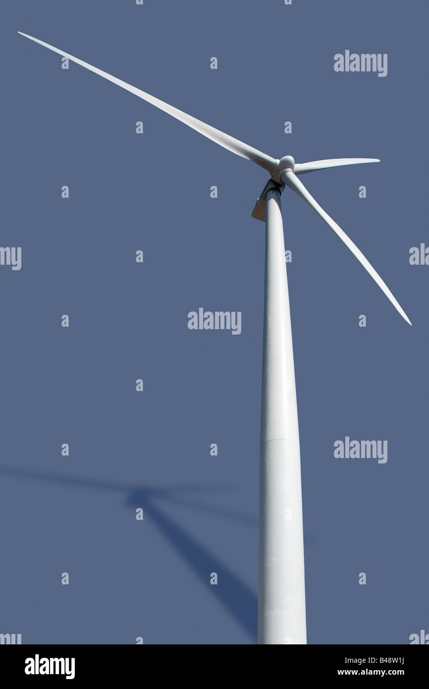 Wind powered electricity generating turbines up on towers There is a saved path included Stock Photo