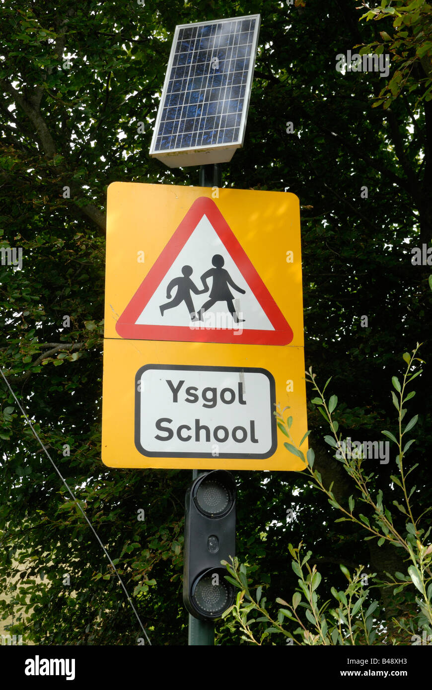 Warning sign outside a school with solar powered lights Stock Photo