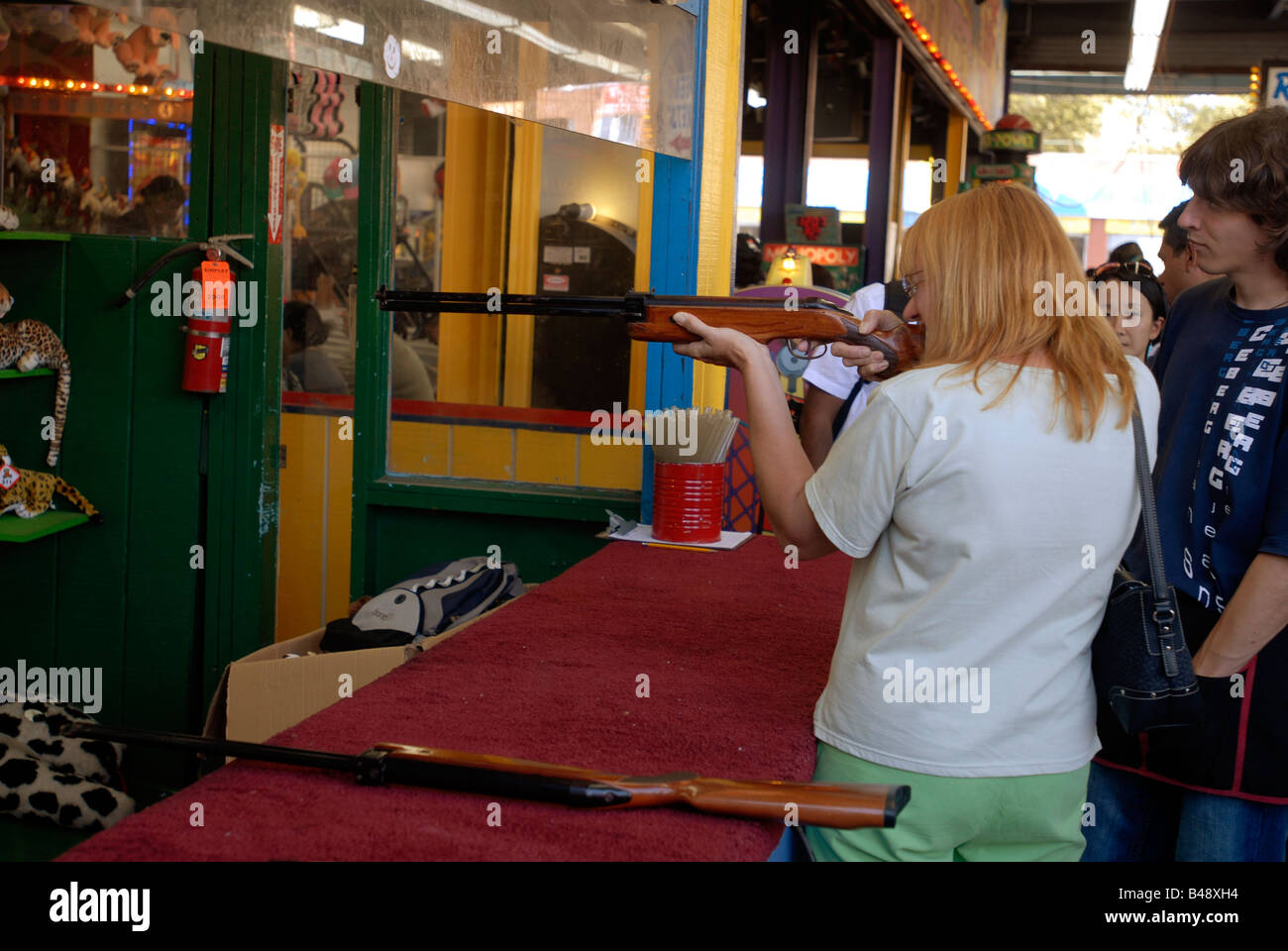 A visitor shoots for prizes in an arcade in Astroland in Coney Island in the Brooklyn borough of New York Stock Photo