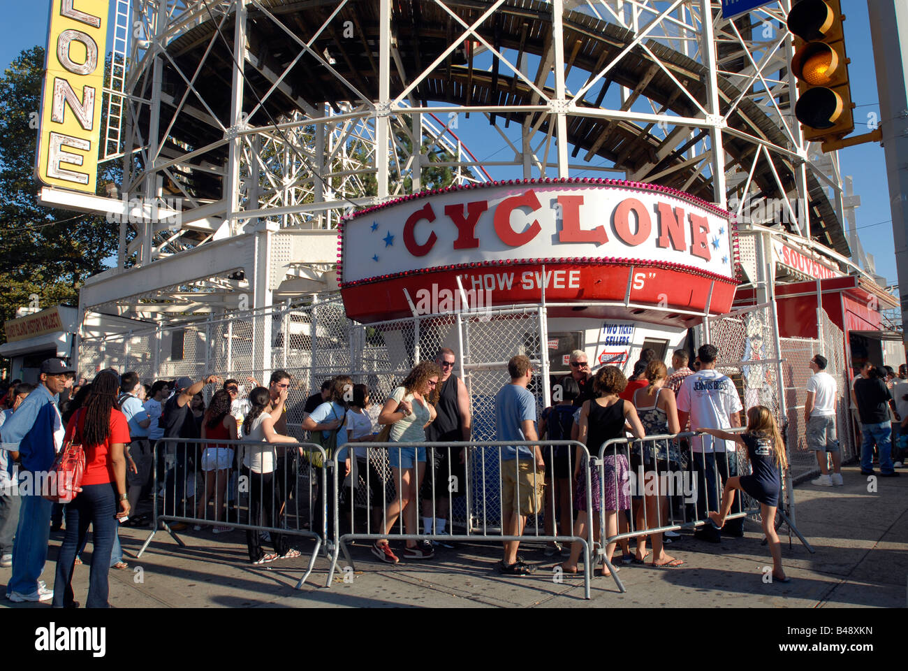 Riders queue up to buy tickets for the Cyclone rollercoaster in