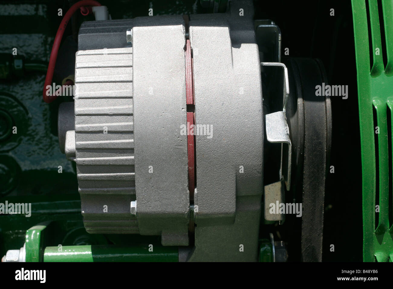 Alternator on a farm tractor diesel engine Stock Photo Alamy
