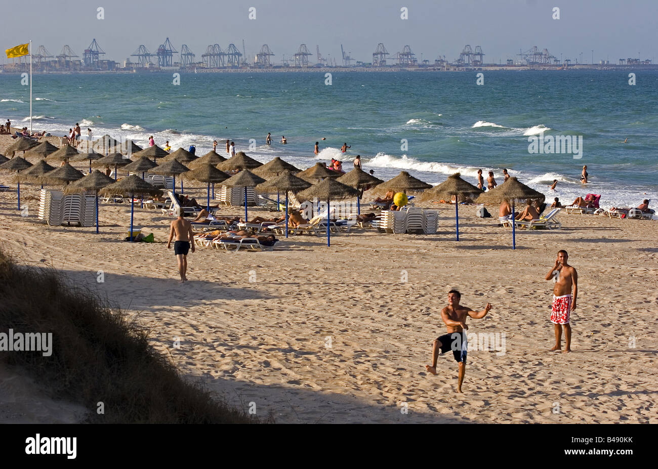 Youngs playing soccer in El Saler beach Valencia Spain Stock Photo