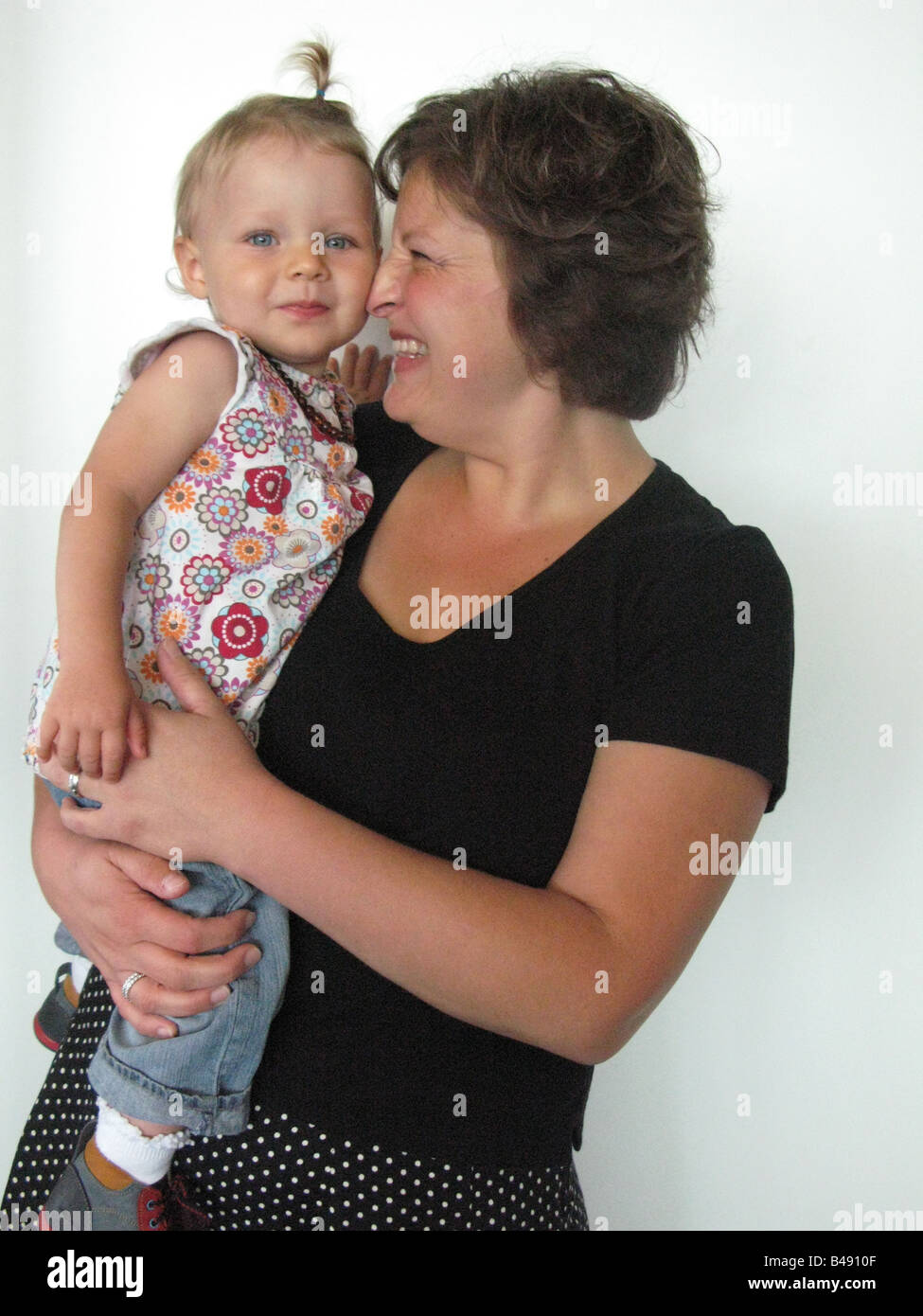 Portrait of smiling mother and child Stock Photo - Alamy