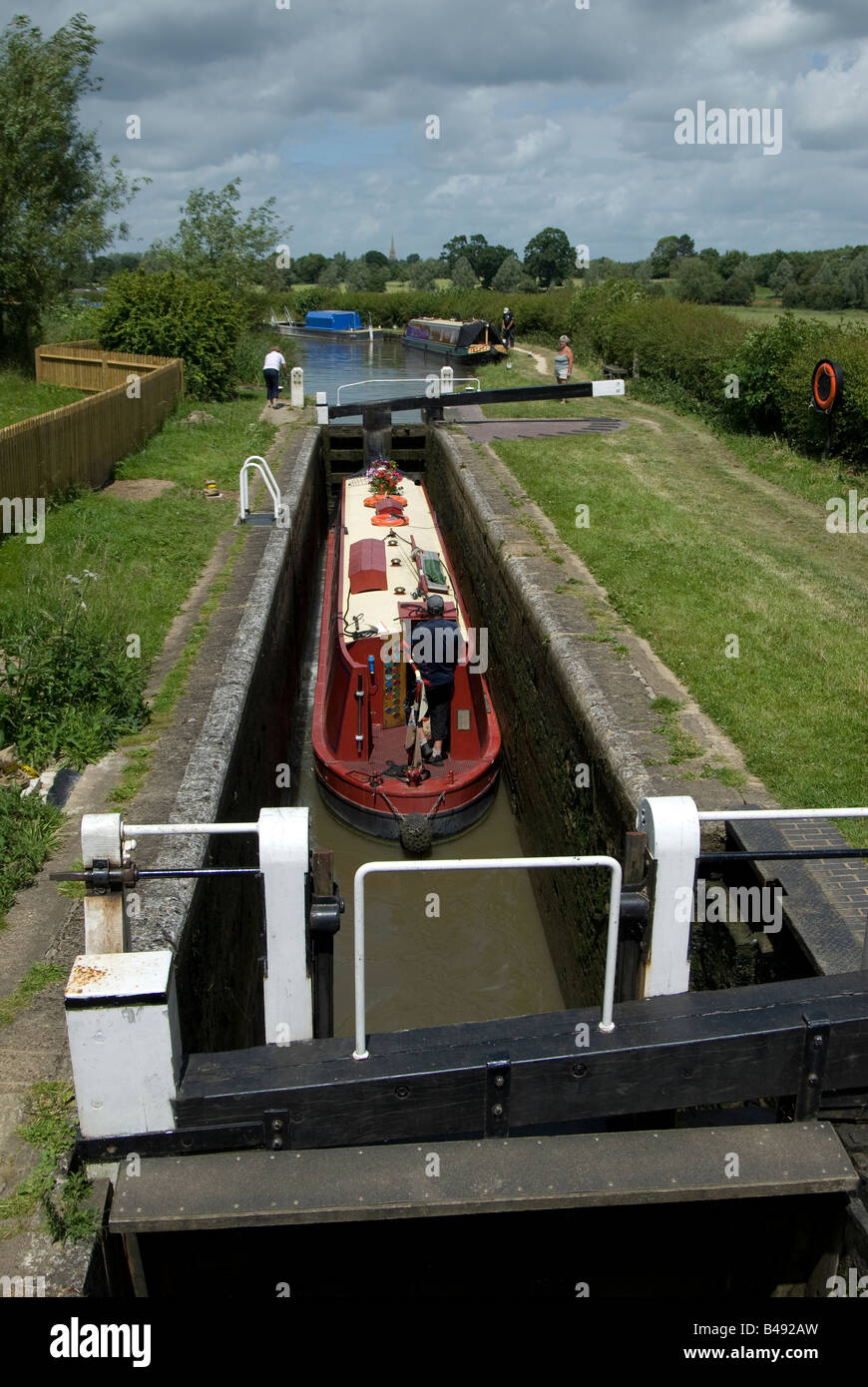 A narrow boat using Nell Bridge lock near Aynho. UK Stock Photo