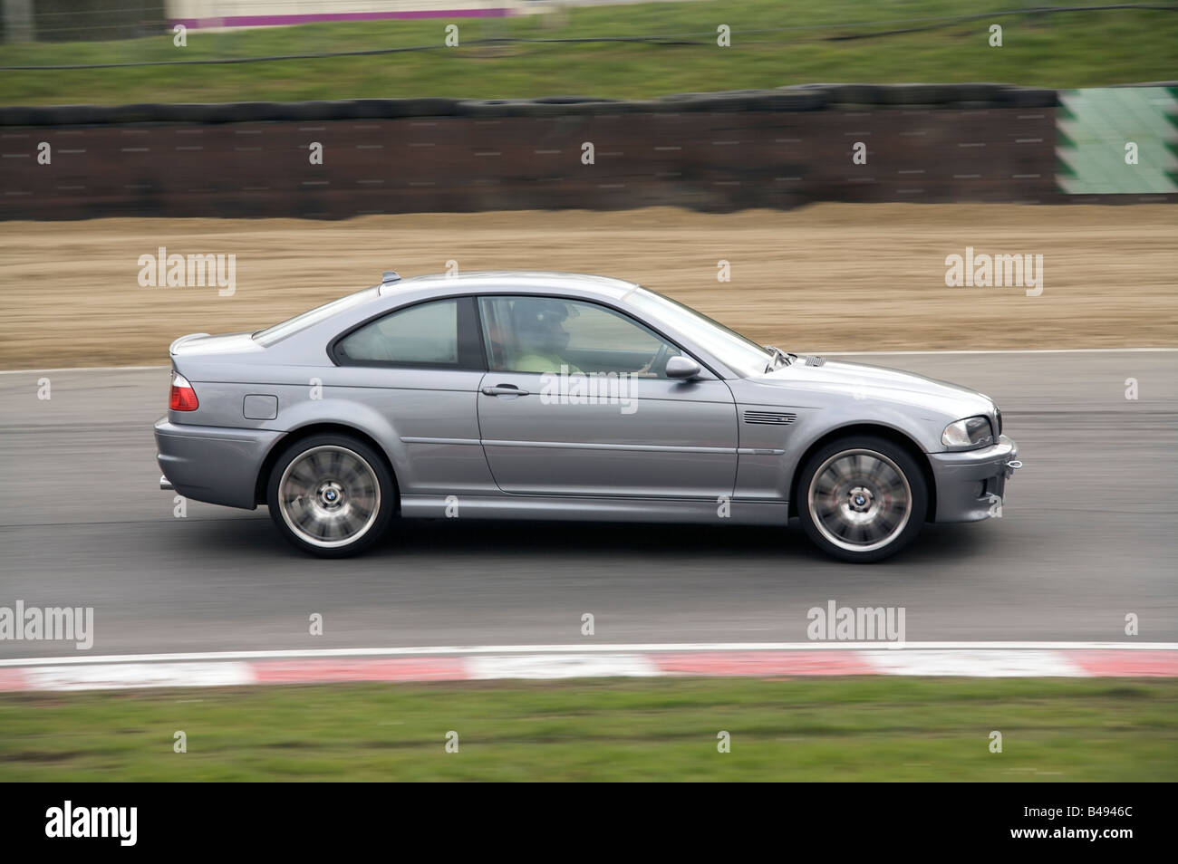 BMW during a track day at Brands Hatch Racing Circuit approaching Druids Bend Stock Photo