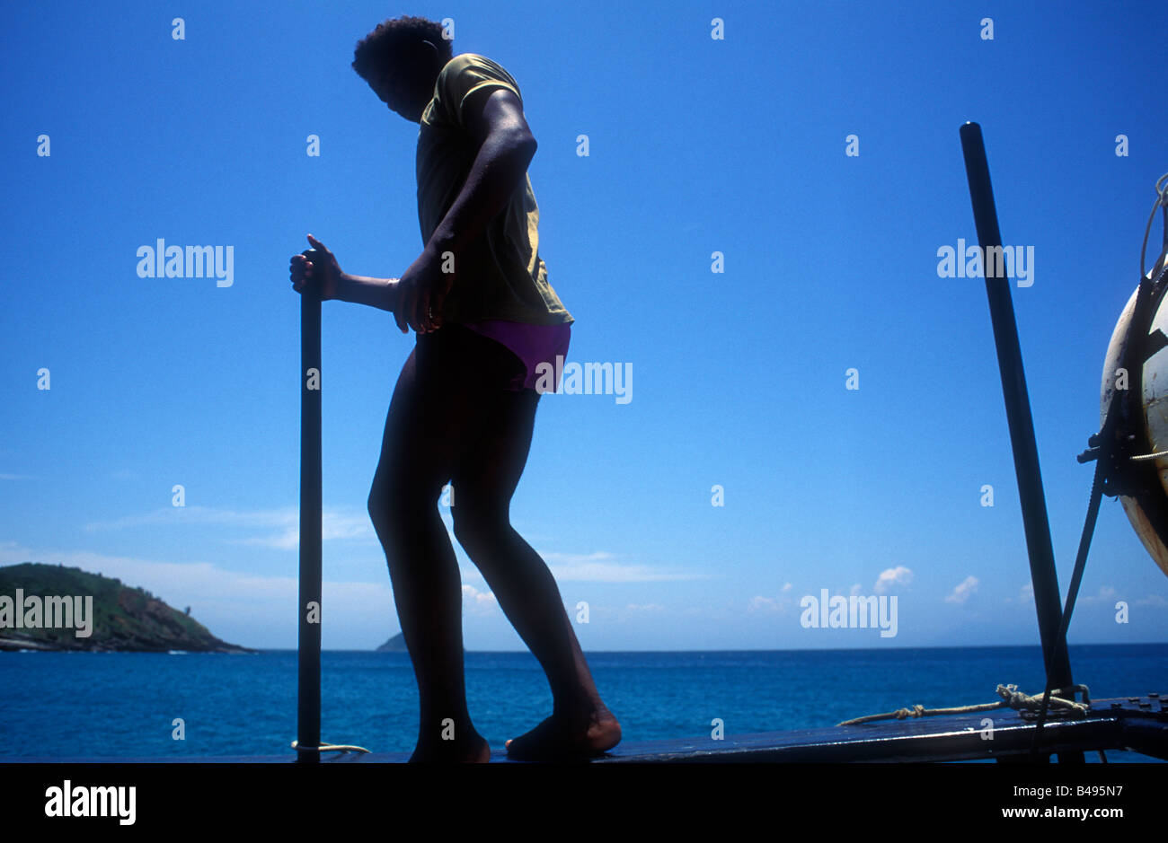 man walking over pier, brazilian beach Stock Photo