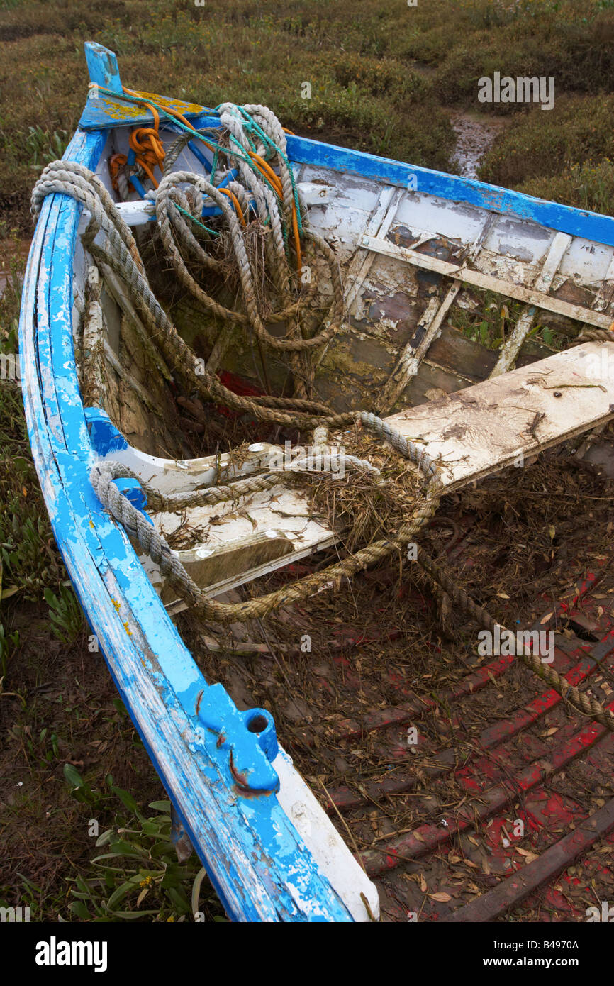An abandoned boat in the marshes at Burnham Deepdale on the North Norfolk Coast Stock Photo