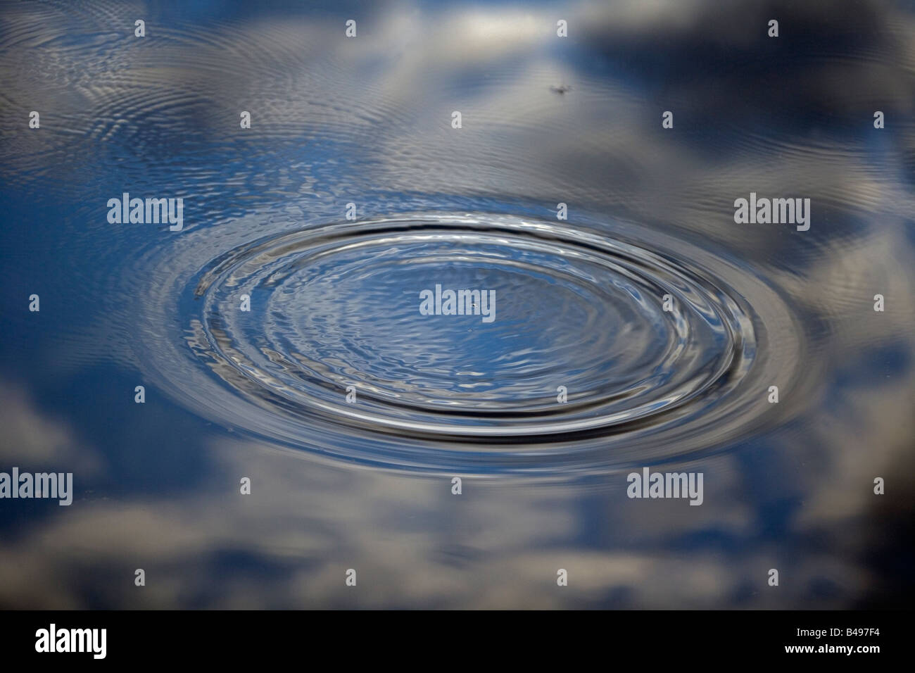 Ripple on Water Showing Reflection of Clouds- Lakenheath Fen - England - UK Stock Photo