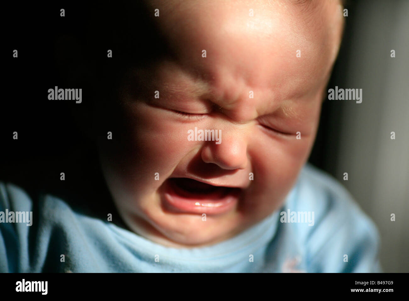 5 month old baby girl crying Stock Photo