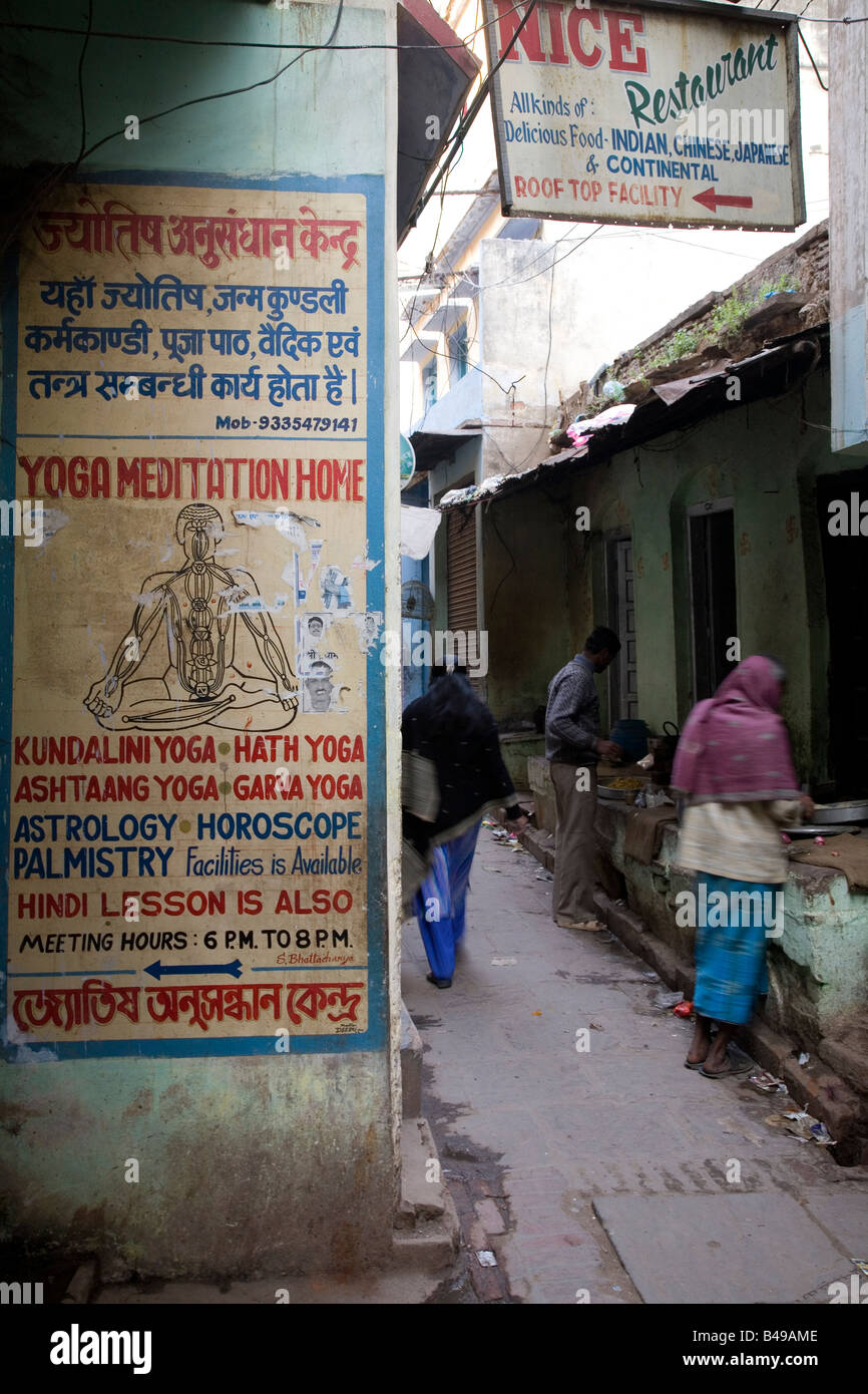 One of the narrow lanes of Varanasi, India. A poster advertising