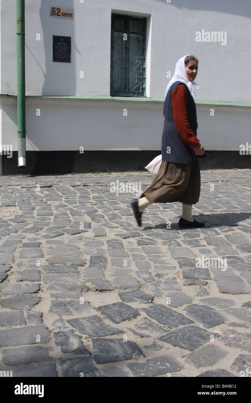 Woman old cobbled street hi-res stock photography and images - Alamy