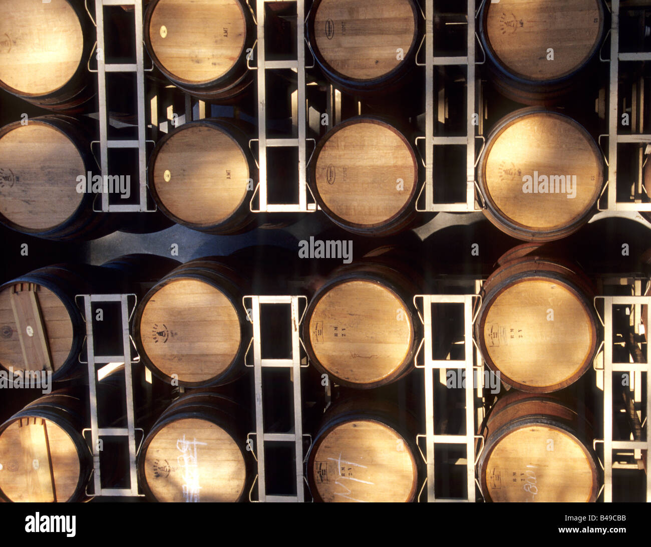 Oak wine barrels stacked in Napa Valley, California Stock Photo