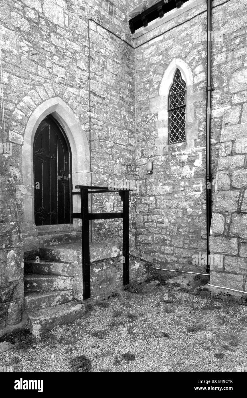 The rear door of St John the Baptist Church in the village of Leusdon within Dartmoor National Park England Stock Photo