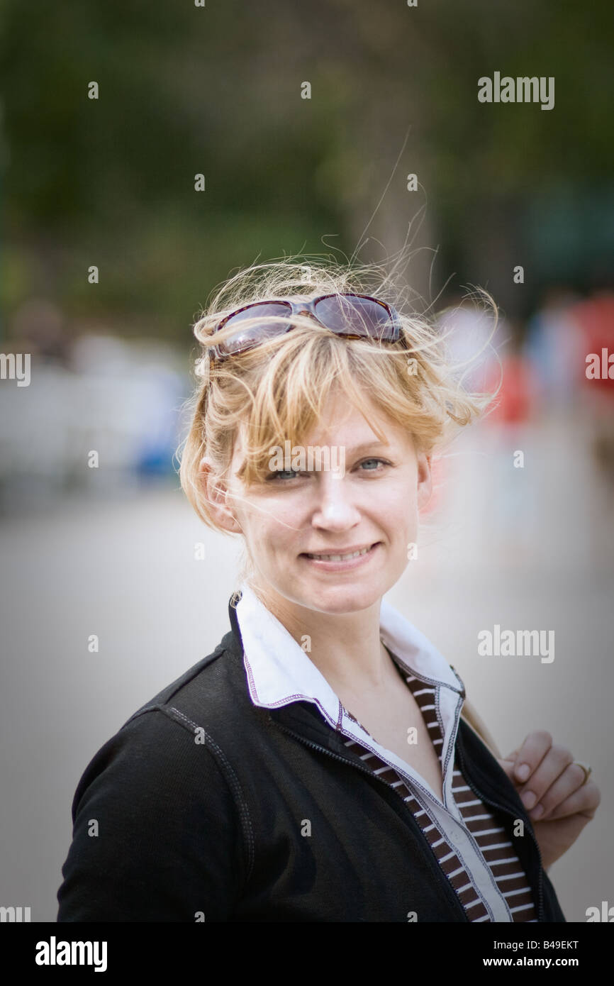 Portrait of a blond woman with messy hair, on a windy day, Winnipeg, Manitoba, Canada. Stock Photo