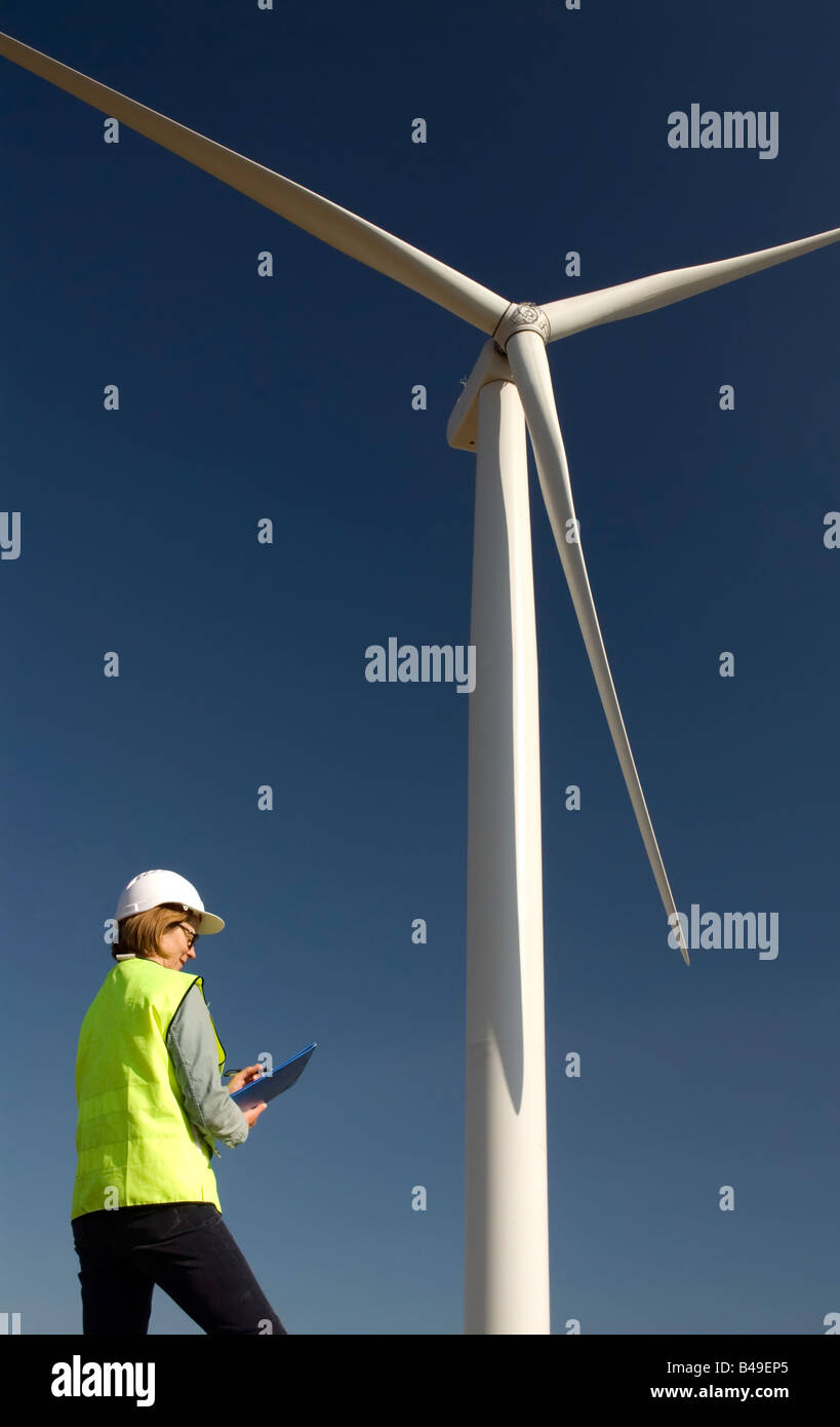 Female engineer next to wind turbine wind farm Stock Photo Alamy