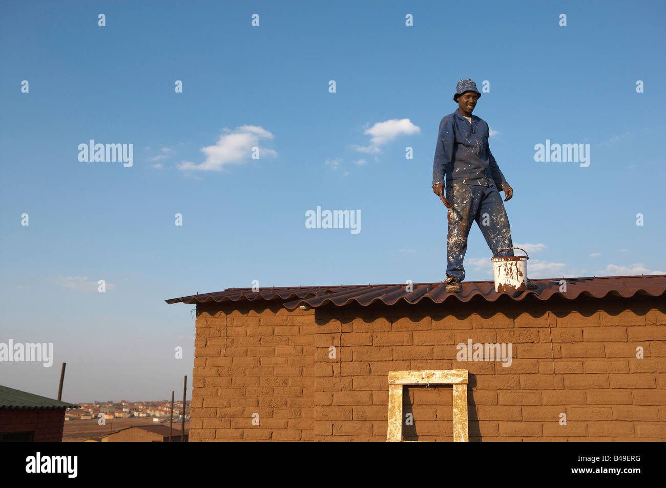 Painter working on RDP house Johannesburg South Africa Model Released