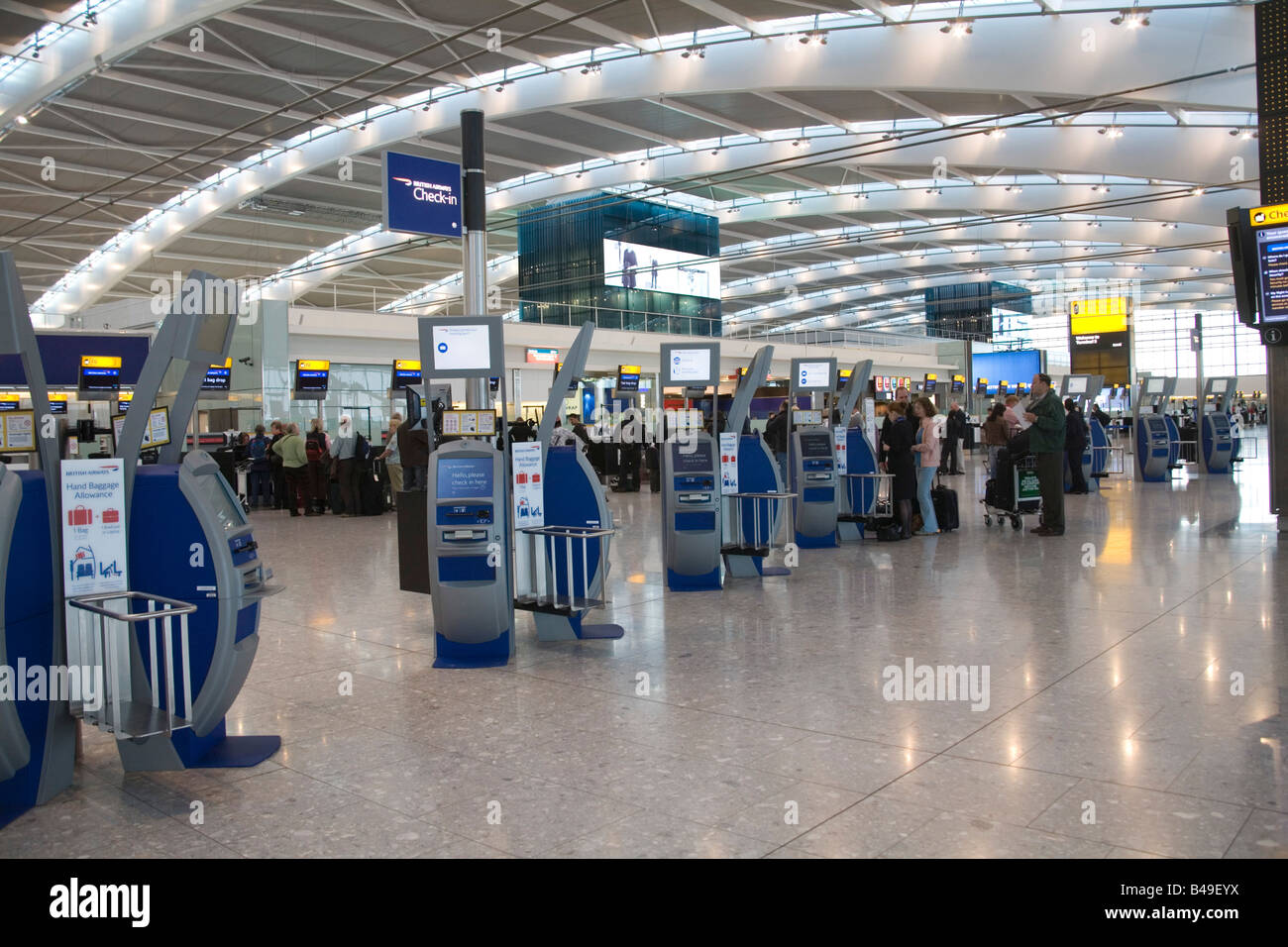 Heathrow Airport London England UK September British Airways self service check in machines and desks in the Departures hall Stock Photo