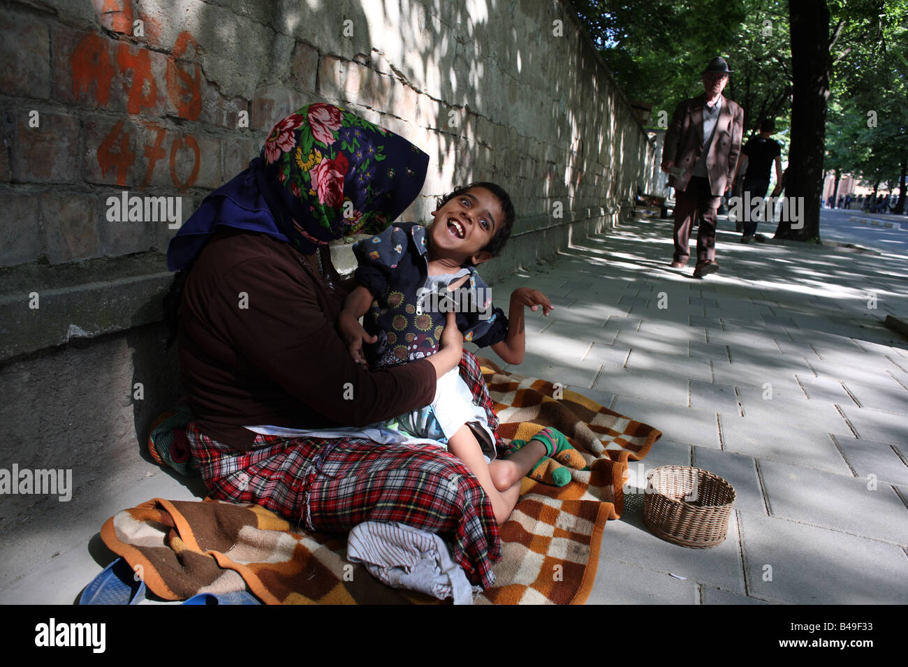 Gypsy beggar with a Russian child Gypsy beggar with a Russian child