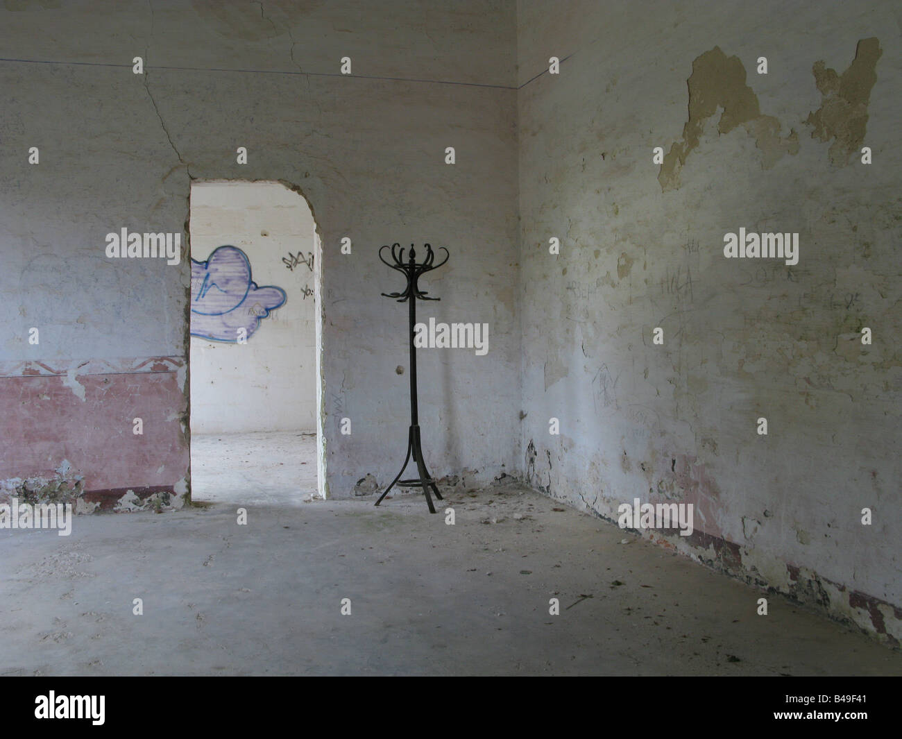 A hat stand in the corner of an abandoned building on Hospital Island in Mahon Harbour, Menorca, Spain Stock Photo