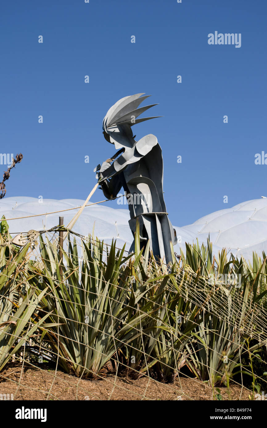 Giant metal man gardener sculpture Eden Project blue sky Bodelva St