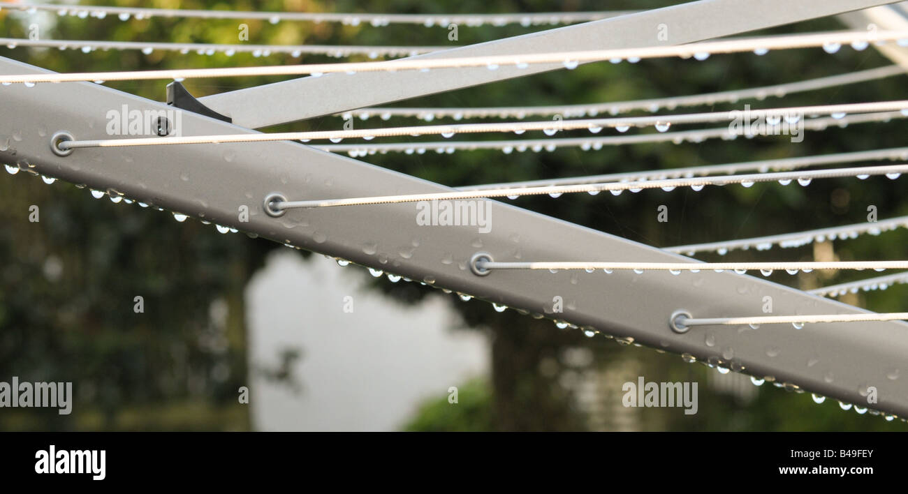 Rain drops on rotary washing line Stock Photo