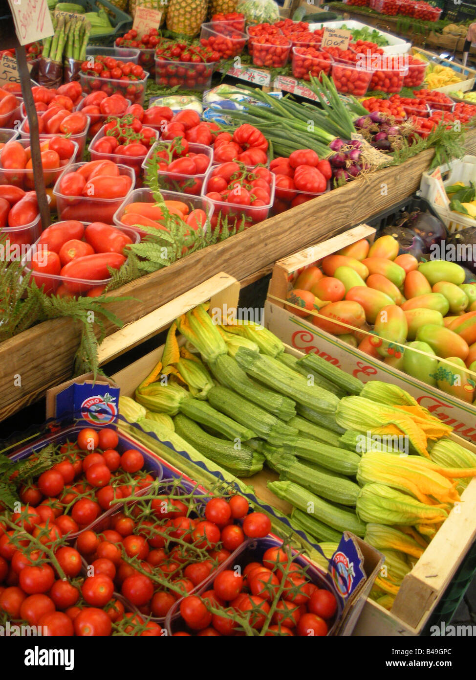 Fresh tomatoes and zucchini (blossoms) for sale at the Campo de Fiori market in Rome Italy Stock
