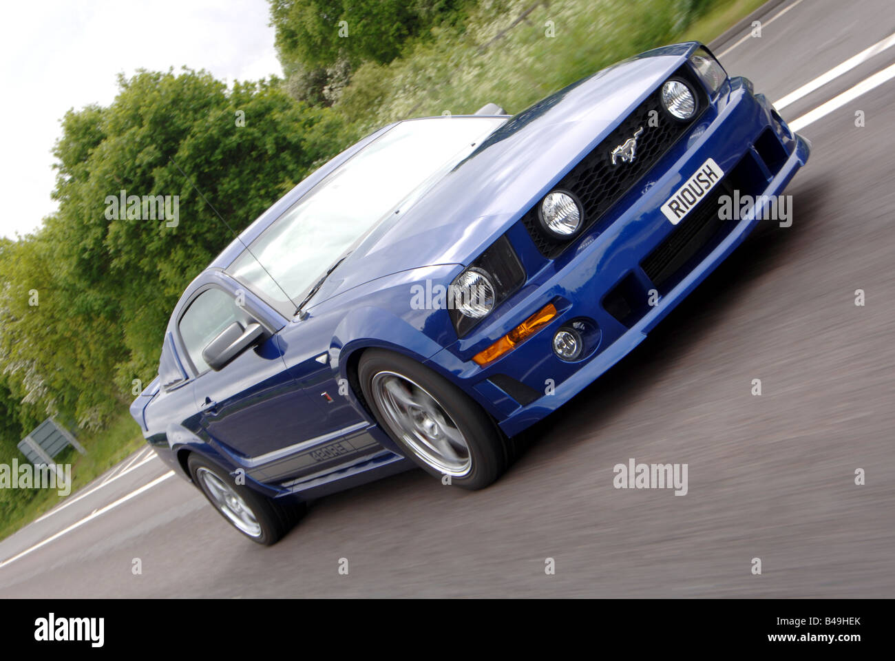 Roush Ford Mustang driving tracking car to car action Stock Photo