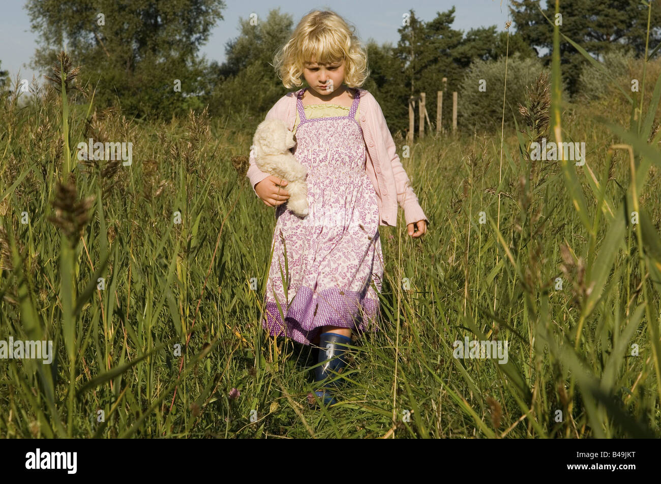 Girl on a meadow Stock Photo - Alamy