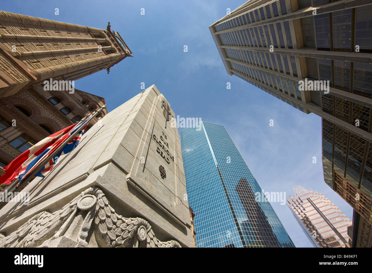 The Cenotaph and Old City Hall surrounded by modern buildings in downtown Toronto, Ontario, Canada. Stock Photo