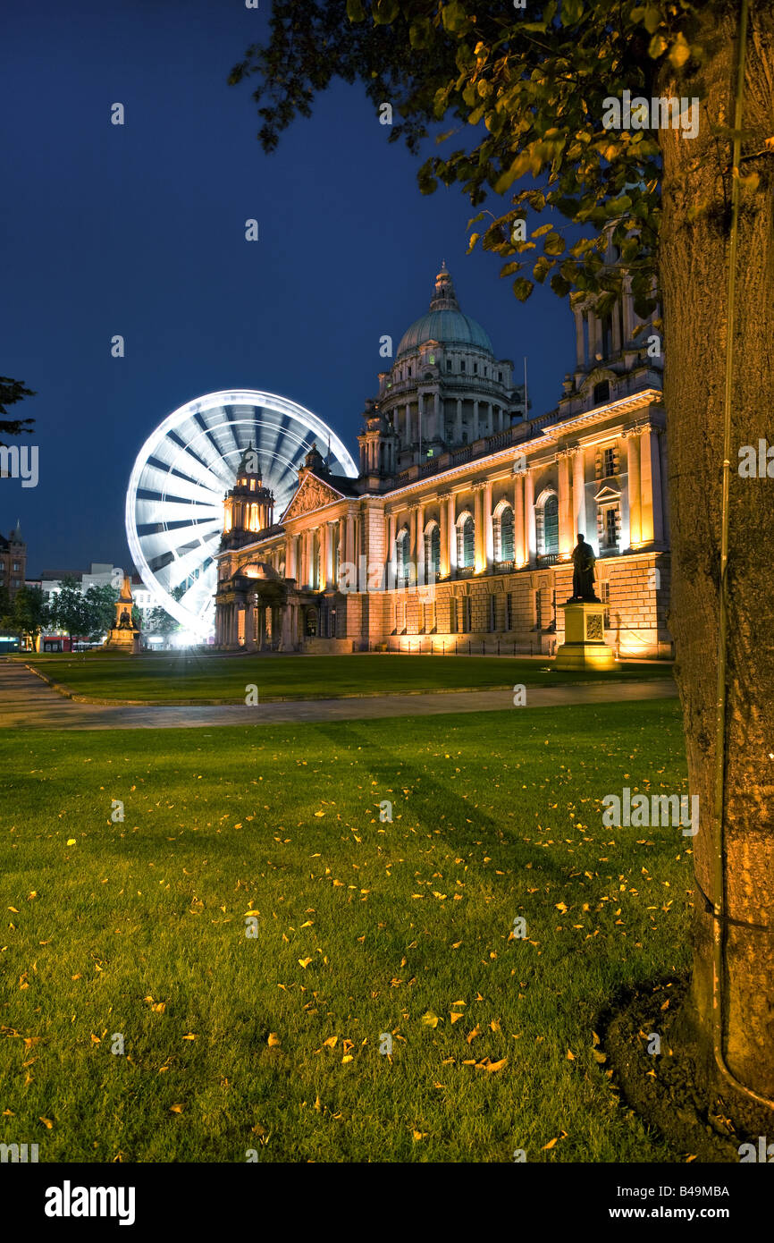 Night shot of Belfast's City Hall with Belfast Eye in background.. Stock Photo