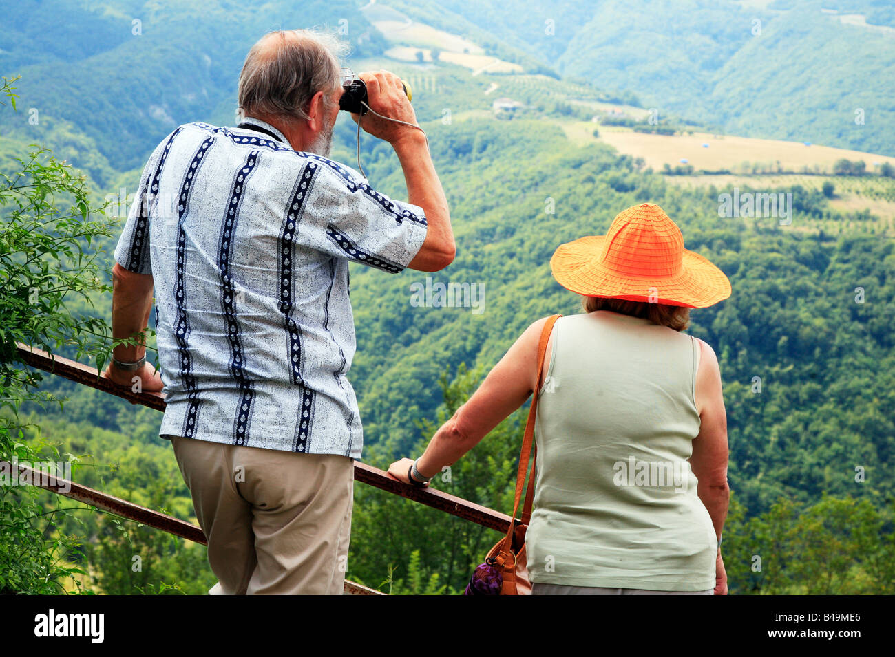 Retired couple admiring landscape in Langhe Valleys Piemonte Italy Stock Photo