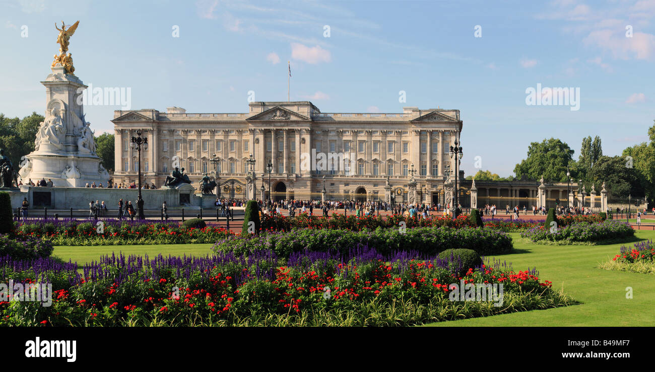 LONDON, UK - SEPTEMBER 14, 2008:  Panorama view of Buckingham Palace and Queen Victoria Monument seen across the bedding display in Memorial Garden Stock Photo