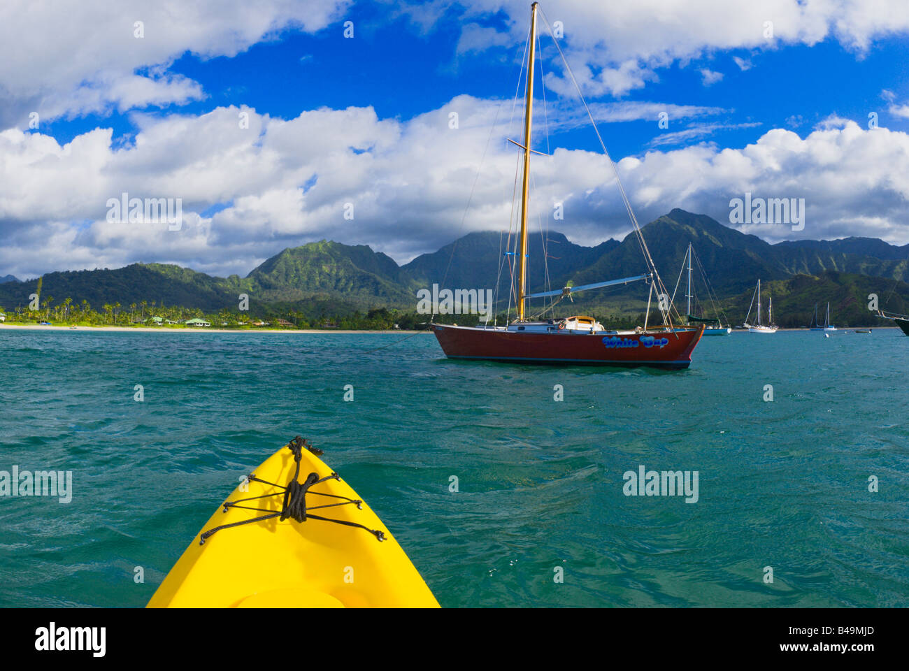 Kayak and sail boat on Hanalei Bay North Shore Island of Kauai Hawaii