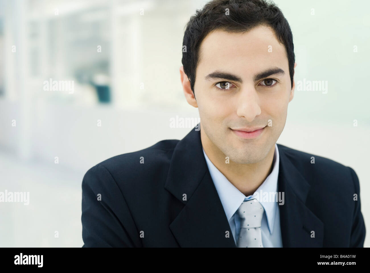 Businessman smiling at camera, portrait Stock Photo - Alamy