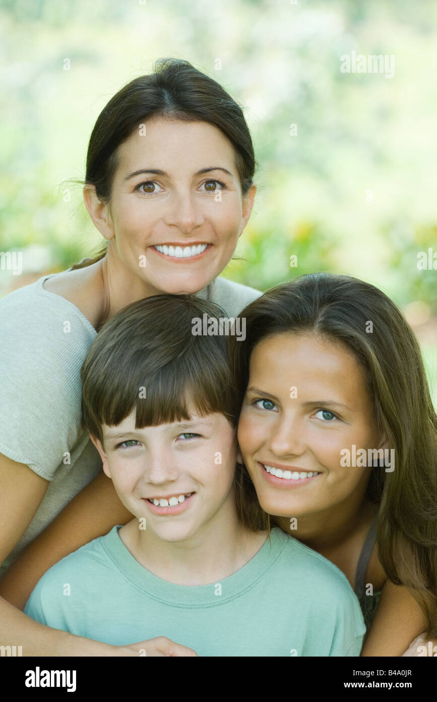 Portrait of mother with teenage daughter and son Stock Photo