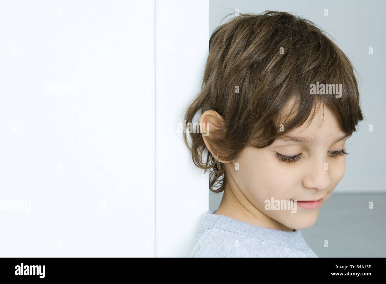 Boy looking down, portrait Stock Photo