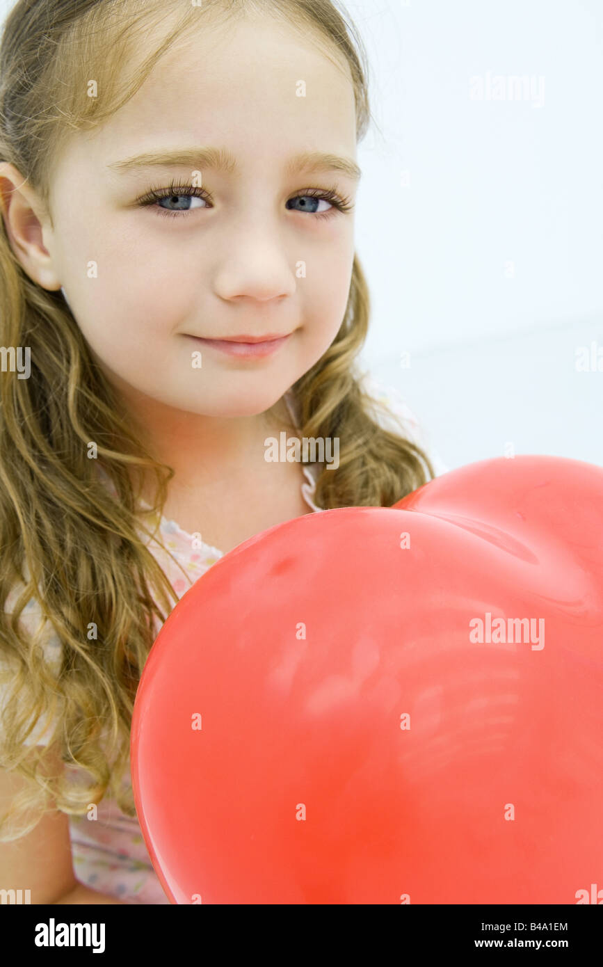 Little girl holding heart shaped balloon, closeup Stock Photo Alamy