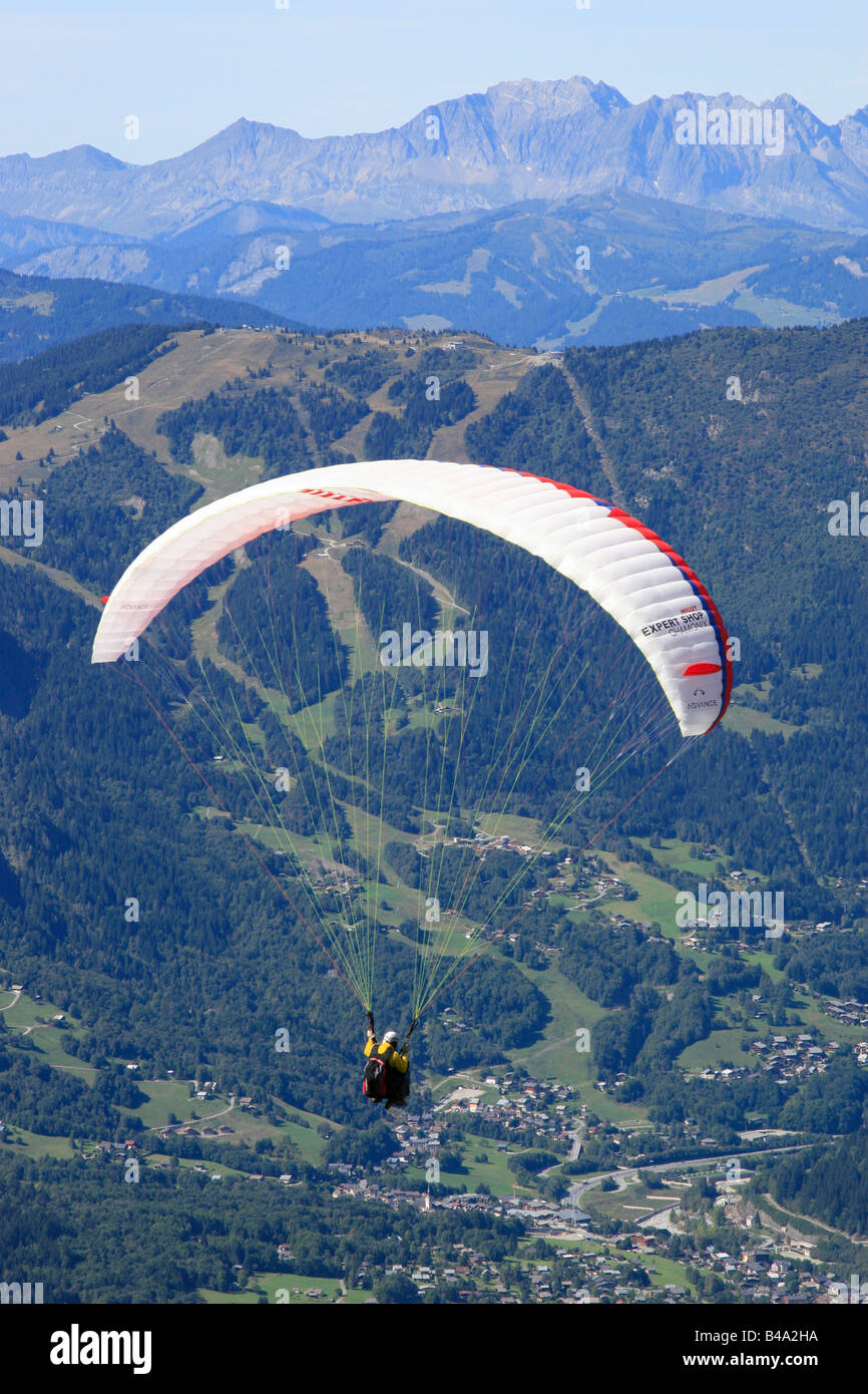 Paragliders launch from the Plan de l'Aiguille into the chamonix valley in the French alps Stock Photo