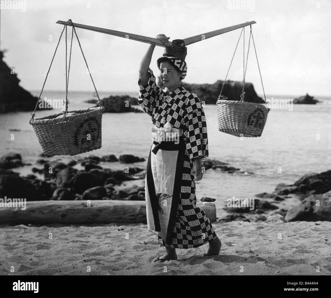 geography / travel, Japan, people, women, woman carrying baskets on head, full length, Shikine Island, 1950s, Stock Photo