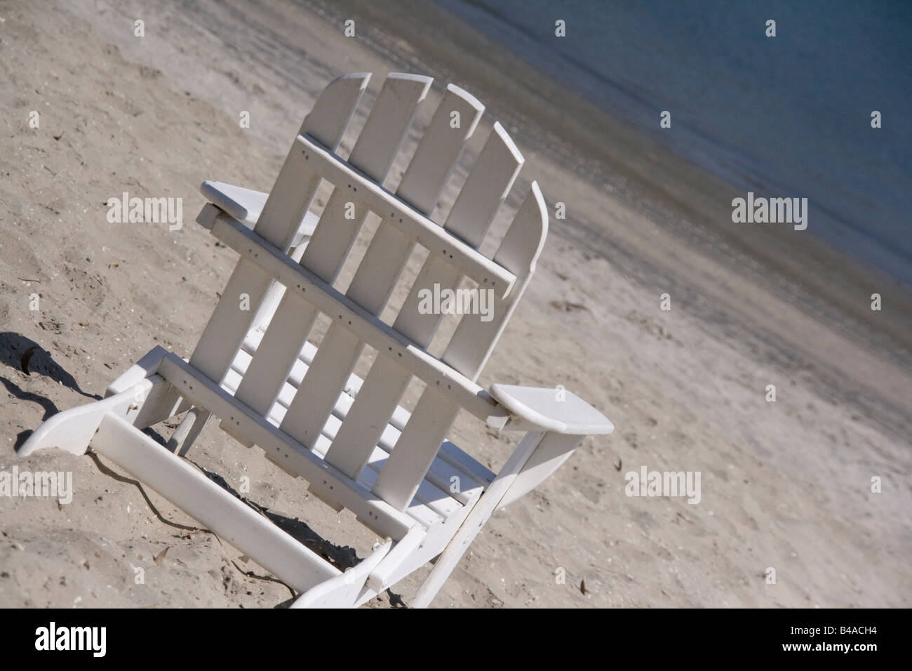 An empty chair on the beach facing the ocean Stock Photo Alamy