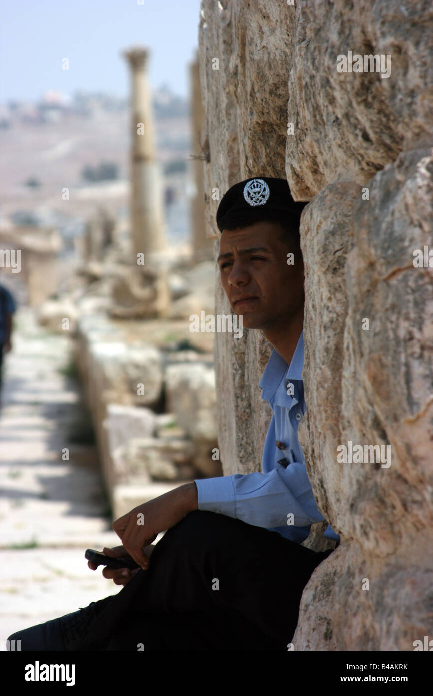 Policeman resting in the shadow, Jerash, Jordan Stock Photo