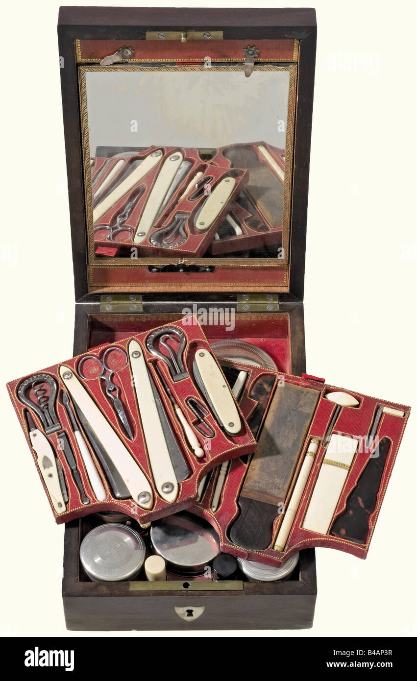 Nicolas-Joseph Maison, Marshal of France (1770 - 1840), a traveler's toiletries kit, 1st half of the 19th century A 36-piece traveler's toiletries kit among other things containing two razors, a pocketknife, toothbrushes, razor strop, and much more. It includes a silver box with the Marshall's monogram as well as a clock in a wooden case (not tested for its function). Many implements with ivory handles. Mahogany case, interior lined with gold-stamped Morocco leather. There is a document drawer in the lid behind a mirror. Overlays on the lid (silver, silver plat, Stock Photo