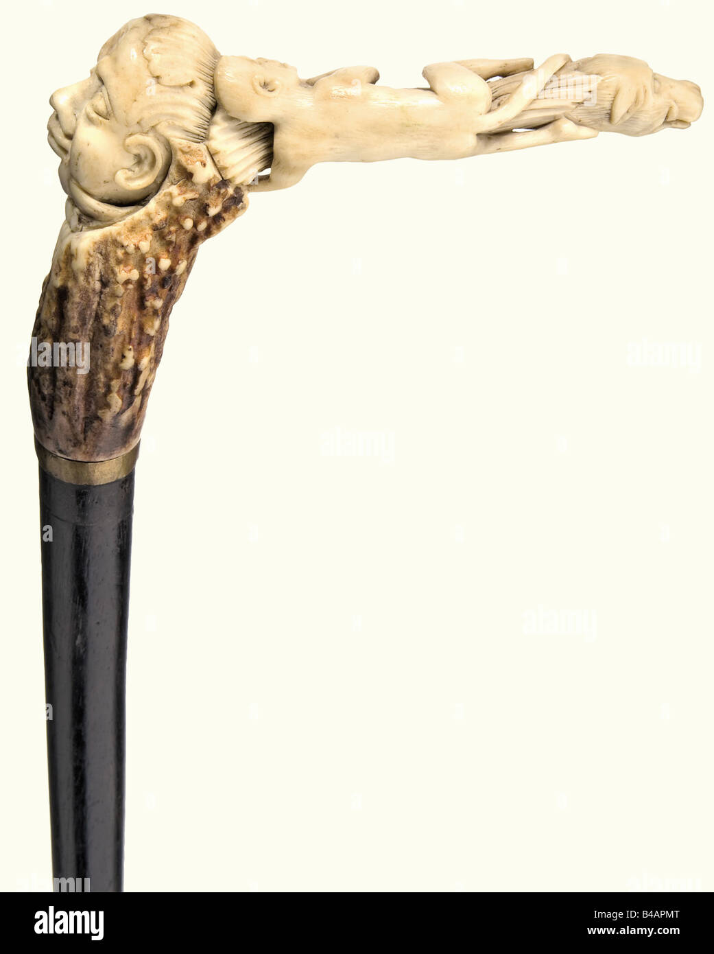 A walking stick, German, circa 1830 Carved staghorn crook handle. The pommel carved in the shape of a man's head with a stiff collar. The crook with apes and lizards terminates in a wild boar's head. Cane of ebonized wood with brass collar and ferrule. Length 91 cm. historic, historical, 19th century, handicrafts, handcraft, craft, object, objects, stills, clipping, clippings, cut out, cut-out, cut-outs, fine arts, art, artful, Stock Photo