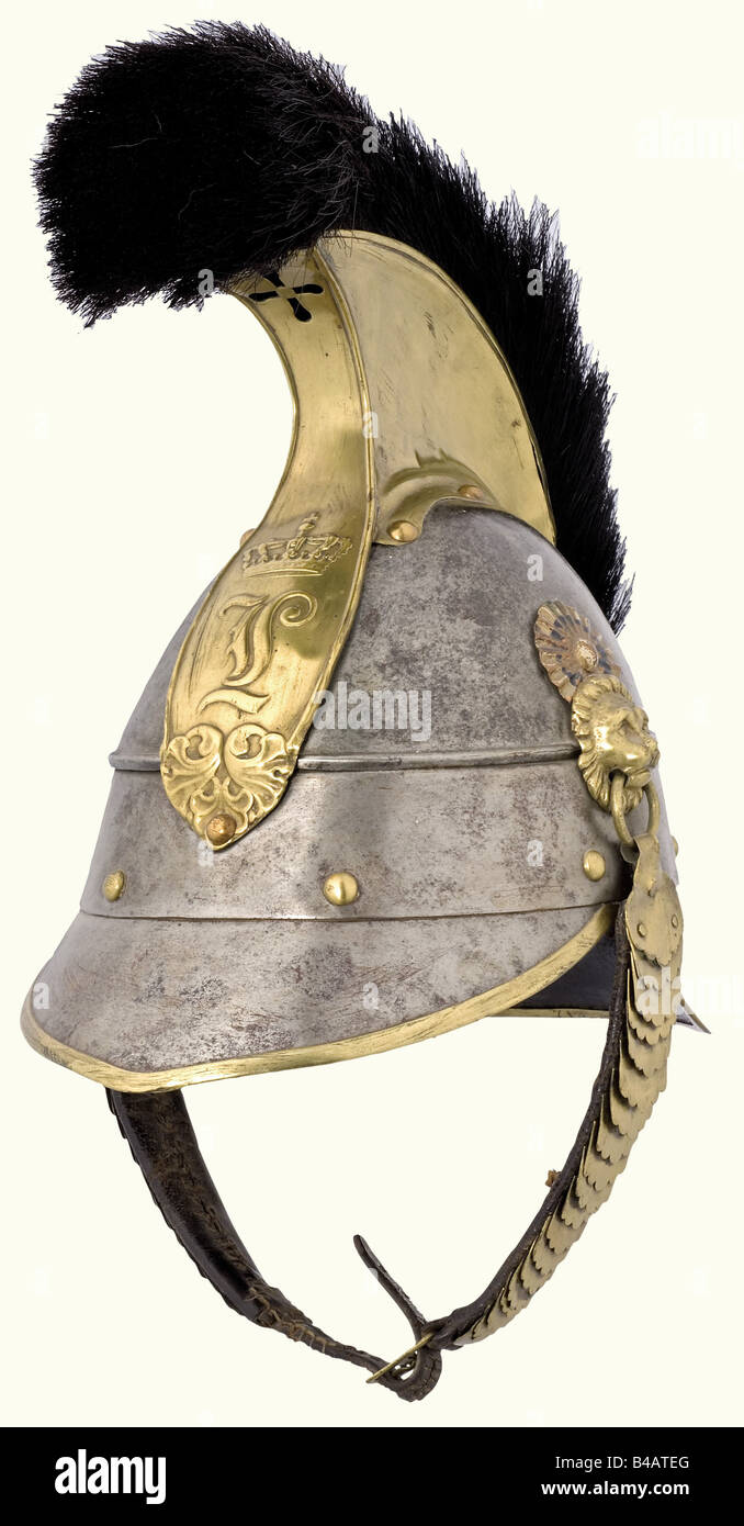 A model 1842 helmet for enlisted personnel, of the Cuirassiers. Sheet steel with brass mountings, and the cipher 'L' on the front plate. Supply room stamp for the 5th Squadron of the 1st Cuirassier Regiment, 1871. With cockade and original horsehair crest with funnel-shaped mount. Lining missing, old repair on comb, one link of the metal chinscales missing, spots of rust film. An easily to improve helmet. See: Seibold/Schulz, Die Helme der k.b. Armee 1806 - 1918, p. 139. historic, historical, 19th century, Bavaria, Bavarian, German, Germany, Southern Germany, t, Stock Photo