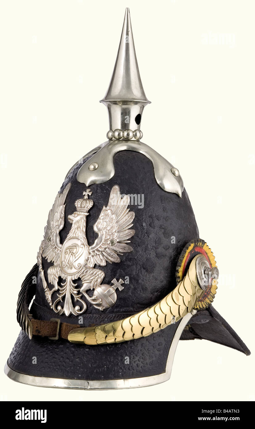 A model 1842/44 helmet for enlisted personnel, of the 1st or 3rd Pioneer Battalion. Private purchase. Leather skull, nickel-silver mountings, eagle with an oval shield bearing the cipher 'FWR' (since 1844) is attached with ring nuts. Brass metal chinscales on screws. Leather cockades in the Prussian and Imperial colours (1848 - 1853). Leather lining. Maker's label in the top. One piece of the strap attaching the metal chinscales is a restoration. Beautiful, complete contemporary helmet. Unfortunately, the lacquered surface is heavily pitted. historic, historica, Stock Photo