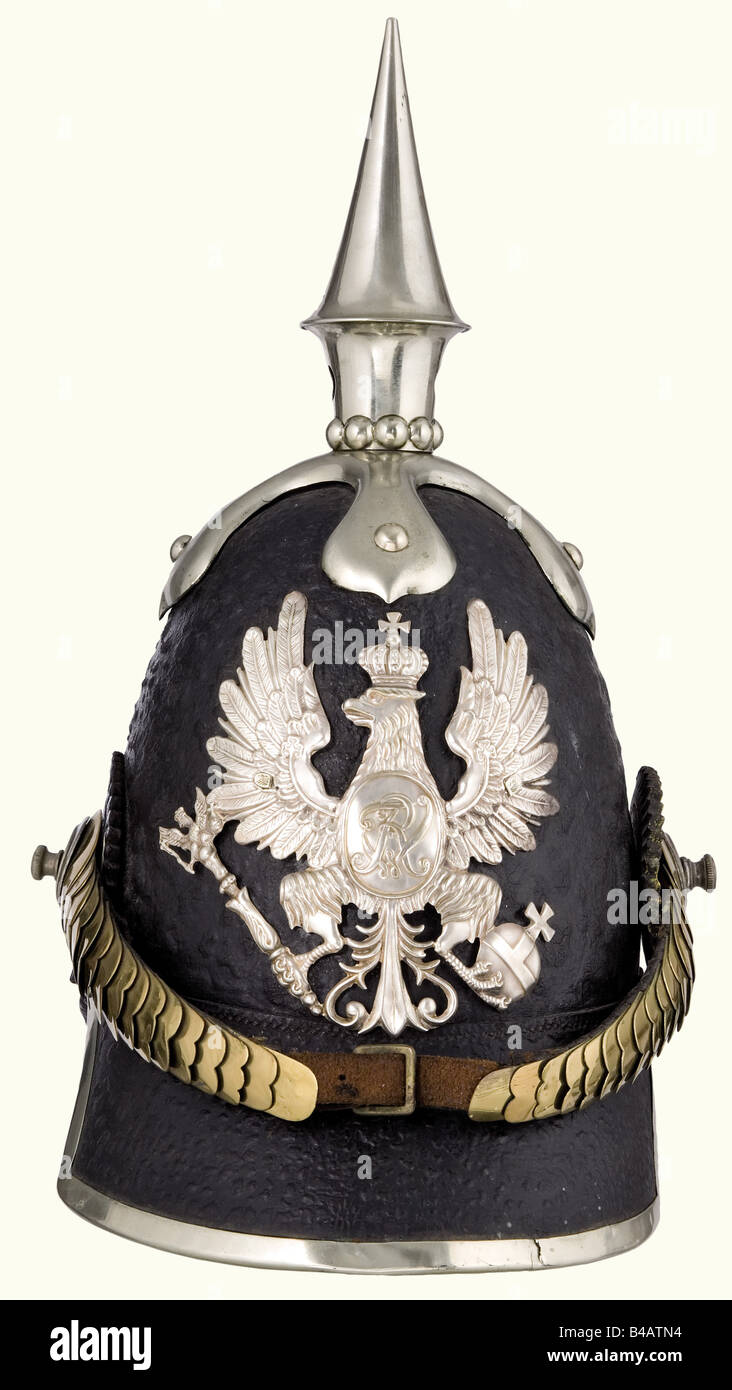 A model 1842/44 helmet for enlisted personnel, of the 1st or 3rd Pioneer Battalion. Private purchase. Leather skull, nickel-silver mountings, eagle with an oval shield bearing the cipher 'FWR' (since 1844) is attached with ring nuts. Brass metal chinscales on screws. Leather cockades in the Prussian and Imperial colours (1848 - 1853). Leather lining. Maker's label in the top. One piece of the strap attaching the metal chinscales is a restoration. Beautiful, complete contemporary helmet. Unfortunately, the lacquered surface is heavily pitted. historic, historica, Stock Photo