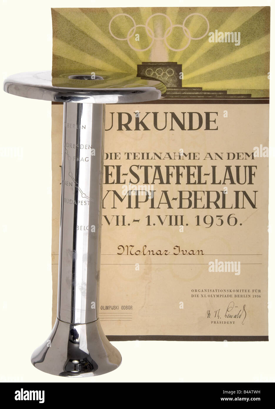 An Olympic torch holder 1936, with certificate for participants. Nicely preserved torch holder made by Krupp AG, Essen from stainless V2A steel with etched decoration. Height 27 cm. The participant's certificate issued to the Yugoslavian relay bearer, Ivan Molnar, with the stamp of the Yugoslavian NOC (National Olympic Committee). historic, historical, 1930s, 20th century, Olympic Games, Olympics, Olympiad, sports, tournament, tourney, tournaments, tourneys, object, objects, stills, clipping, clippings, cut out, cut-out, cut-outs, document, documents, Stock Photo