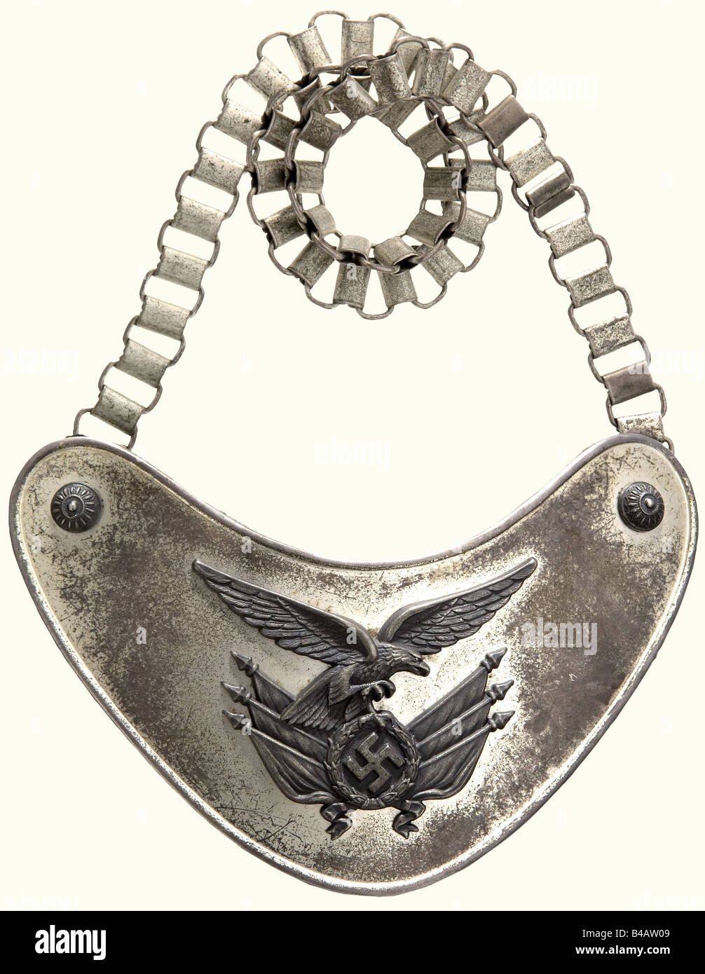 A standard bearer's gorget., Silvered (somewhat faded) white metal with toned fittings and rosettes for the reverse chain hooks, the back is lined with Luftwaffe blue felt. The central hook with manufacturer's mark 'C.E. Juncker, Berlin'. Silvered chain. Ca. 13 x 19 cm. Of the greatest rarity.' historic, historical, 1930s, 1930s, 20th century, Air Force, branch of service, branches of service, armed service, armed services, military, militaria, air forces, object, objects, stills, clipping, clippings, cut out, cut-out, cut-outs, fine arts, art, art object, art , Stock Photo