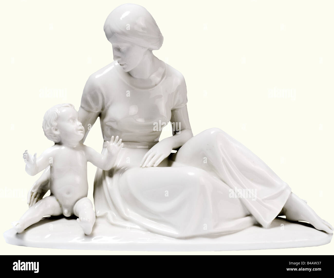 Mother and child., White porcelain figurine. Base with artist's signature 'P. Horn', green underglaze manufactory mark and model number '98'. Right hand of the child restored, otherwise unchipped, extremely decorative and very rare figurine. Height 22 cm.' fine arts, people, 1930s, 1930s, 20th century, object, objects, stills, clipping, clippings, cut out, cut-out, cut-outs, Additional-Rights-Clearance-Info-Not-Available Stock Photo