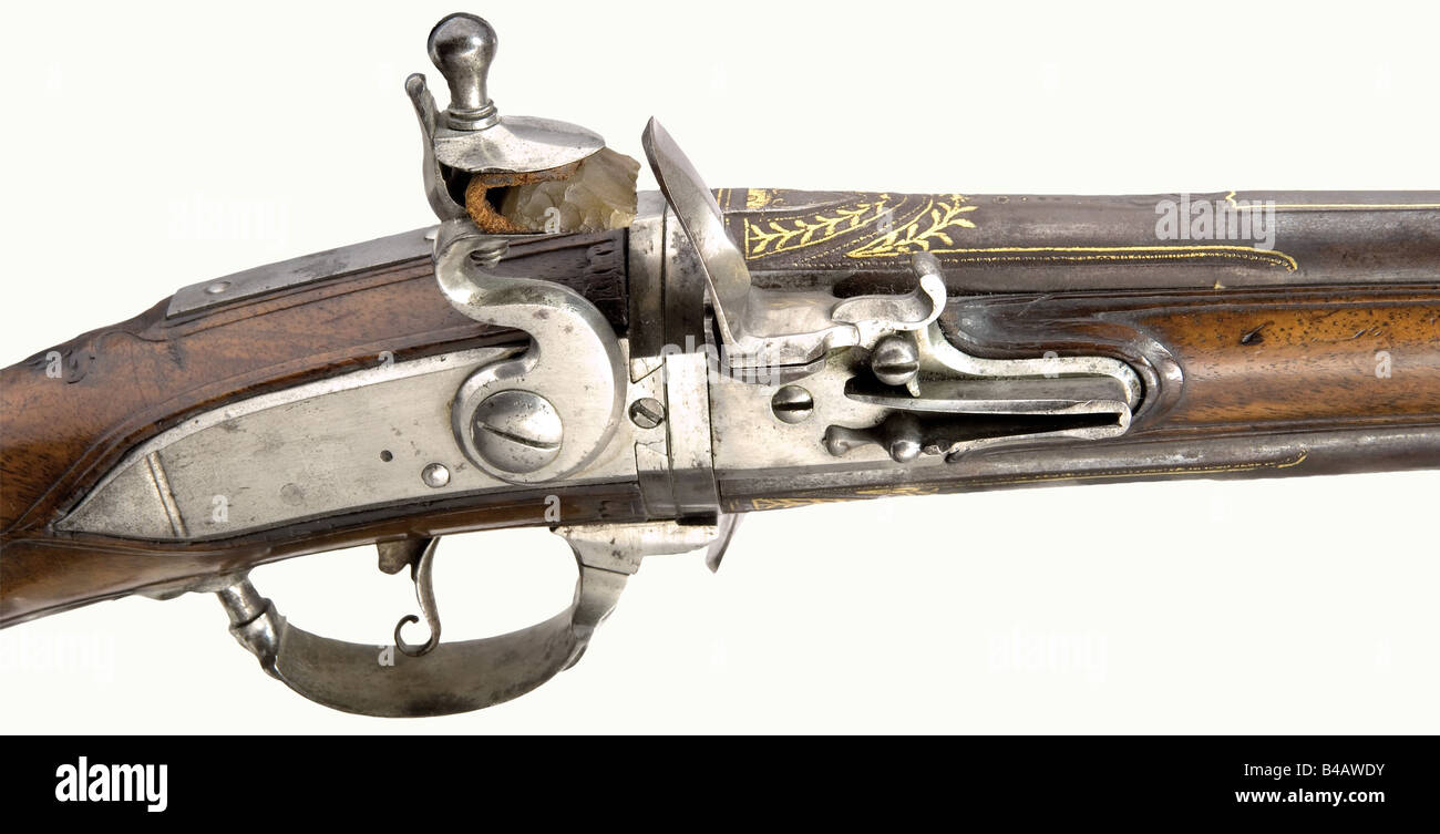A turn-barrel flintlock short musket, Francois à Cambray, circa 1740. Round, smooth bore barrels in 15 mm calibre with raised sighting flats, old bluing and gold inlaid scroll and leaf decoration on the tops. Smooth flintlocks, the right one signed, 'Francois à Cambray' on the edge. Movable trigger guard to latch the barrel pair in place. Walnut stock with iron furniture. Side mounted ramrod with horn tip. Length 74.5 cm historic, historical, 18th century, civil long guns, gun, weapons, arms, weapon, arm, firearm, fire arm, gun, fire arms, firearms, guns, objec, Stock Photo